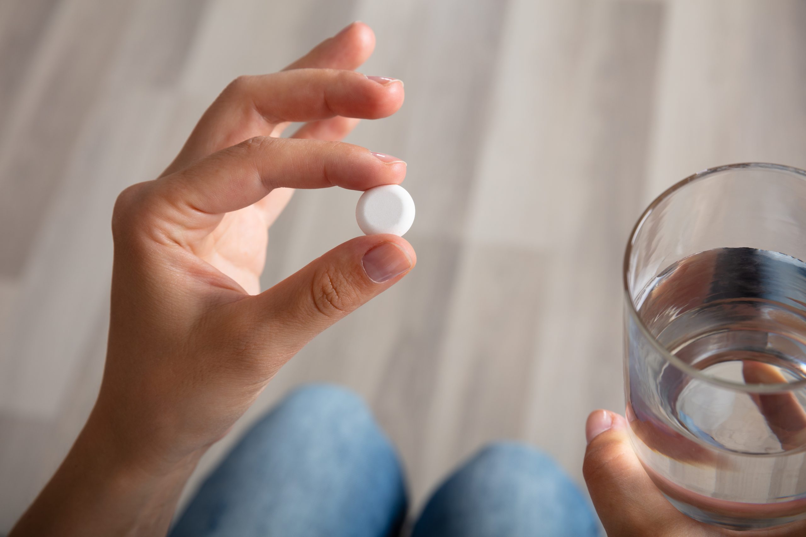 looking_at_pill_water pregnancy testing